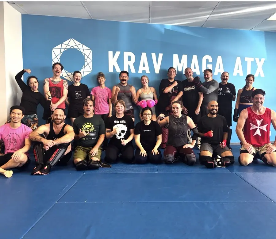 Krav Maga ATX class group photo on the mats